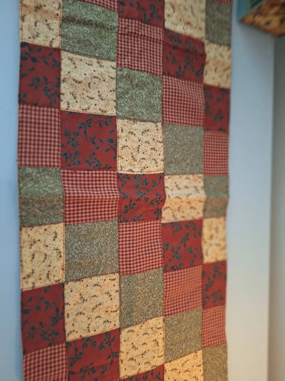 Patchwork Quilted Table Runner in Red, Green, and Cream